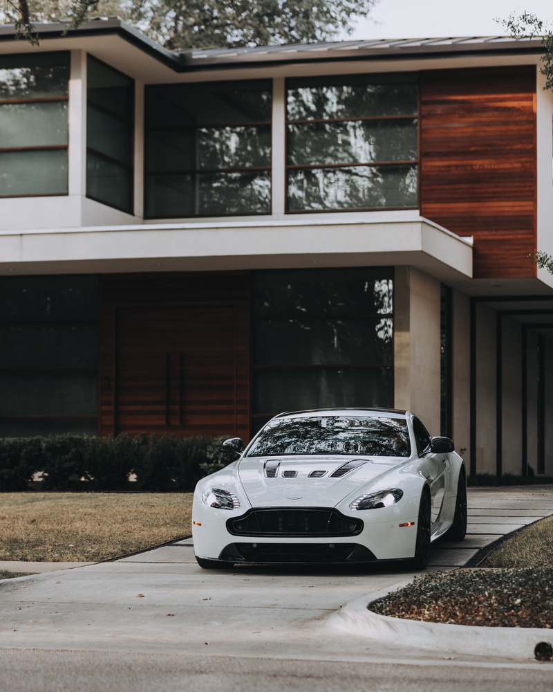 land vehicle, architecture, motor vehicle, mode of transportation, transportation, built structure, parking, building exterior, nature, street, luxury