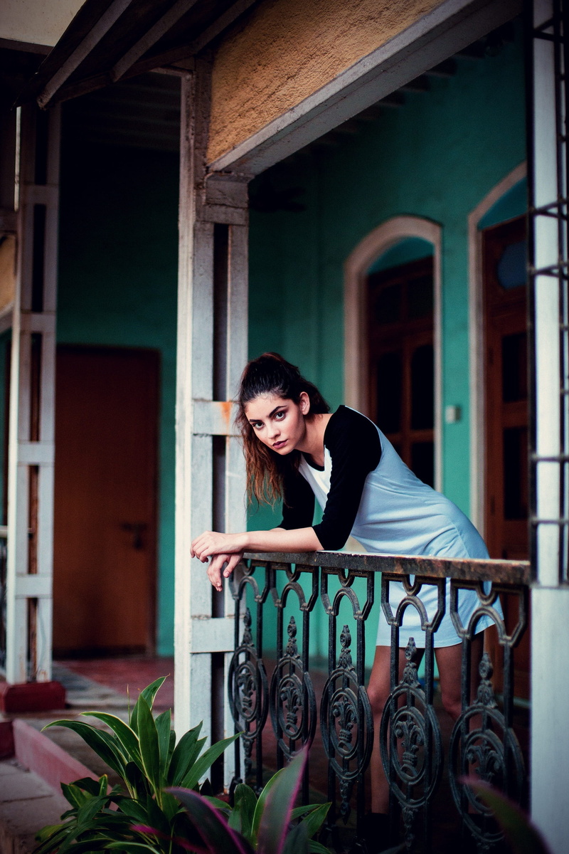 front view, house, young adult, lifestyles, outside, people, real people, one person, leisure activity, women, girl, standing, building exterior, plant