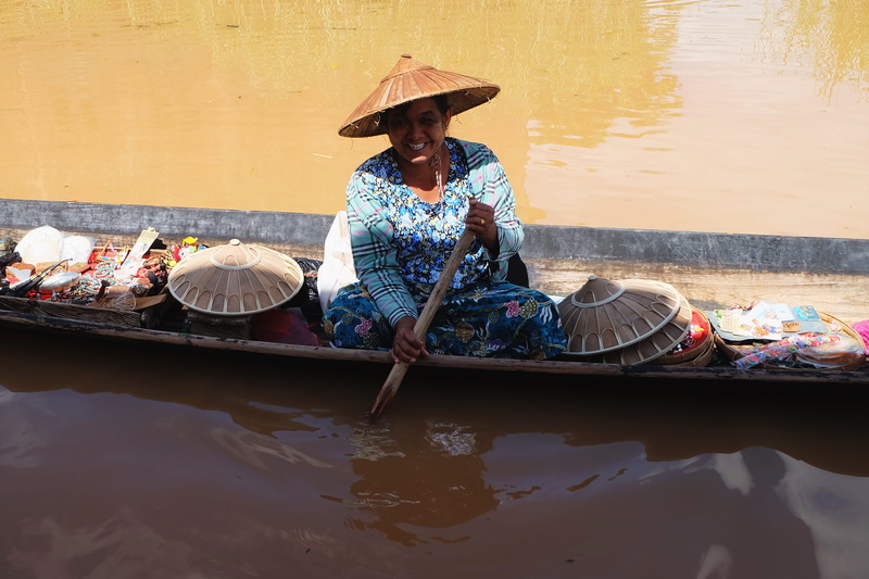 asian, one person, woman, transportation, lifestyles, clothing, outdoors, sitting, adult, riding, hat, asian style conical hat, occupation, women, body