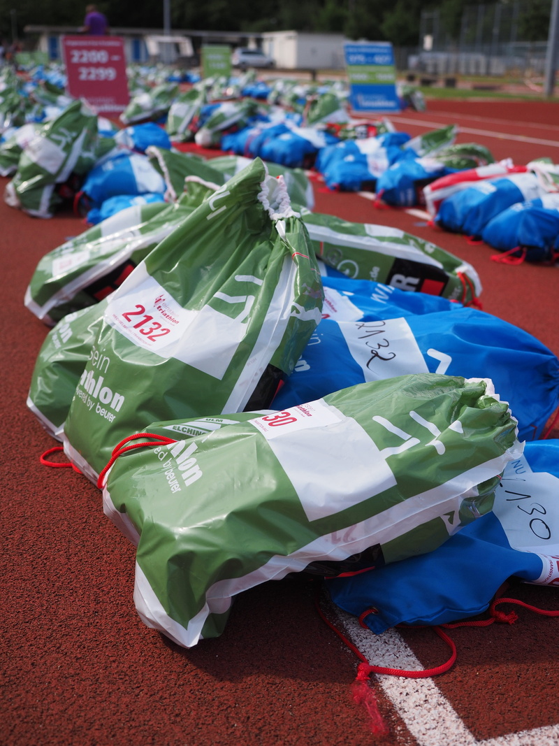 Transport, large group of objects, blue, mapping, high angle view, caption, pieces of luggage, marathon, still life, outdoors, sport event, plastic bag