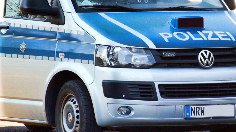 land vehicle, number, city, police, communication, text, commercial land vehicle, truck, security, police usage, metal, tire, car, no people, blue, mode of transportation