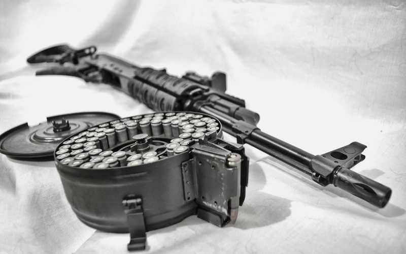 2K, no people, AK-74, equipment, musical instrument, music, close-up, gun, still life, indoors, day, selective focus, security, table, high angle view
